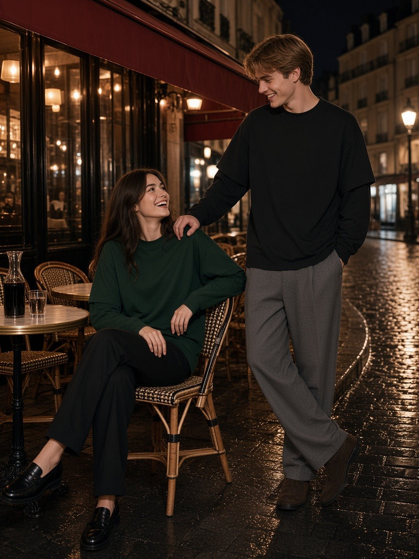Marcel Afters Layered Oversized T-Shirt in Dark Green, worn by a man and a woman, at a Paris cafe table at night, she in dark green and he in black