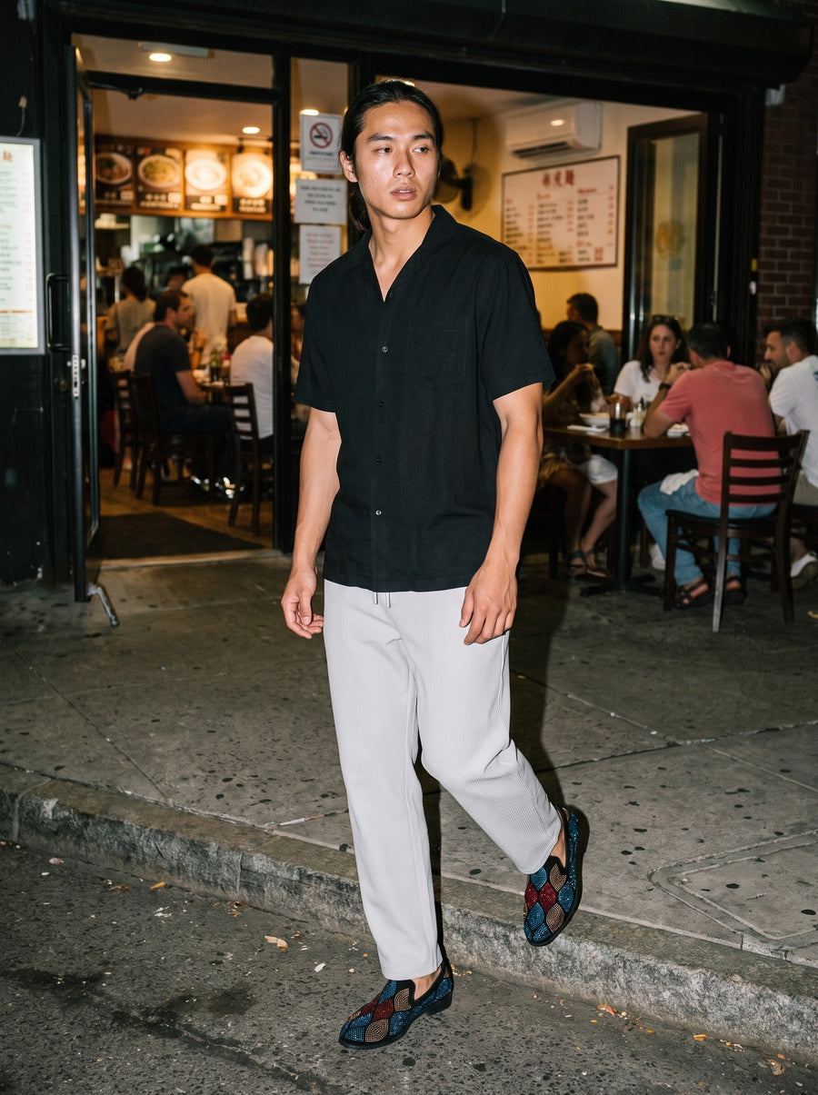 Friends together, one wearing the Marcel Afters Lightweight Cotton Short Sleeve Shirt in Black