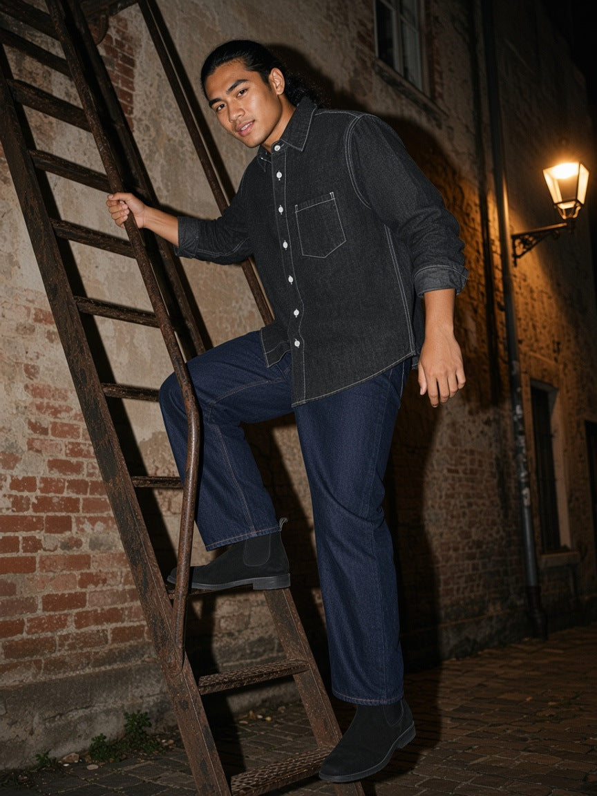 Part of the look Double Down: man in a black vintage-wash denim shirt and navy straight-leg jeans