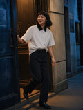 Part of the look Side Door: woman in a white striped boxy contrast-collar shirt and black belted barrel-leg chinos