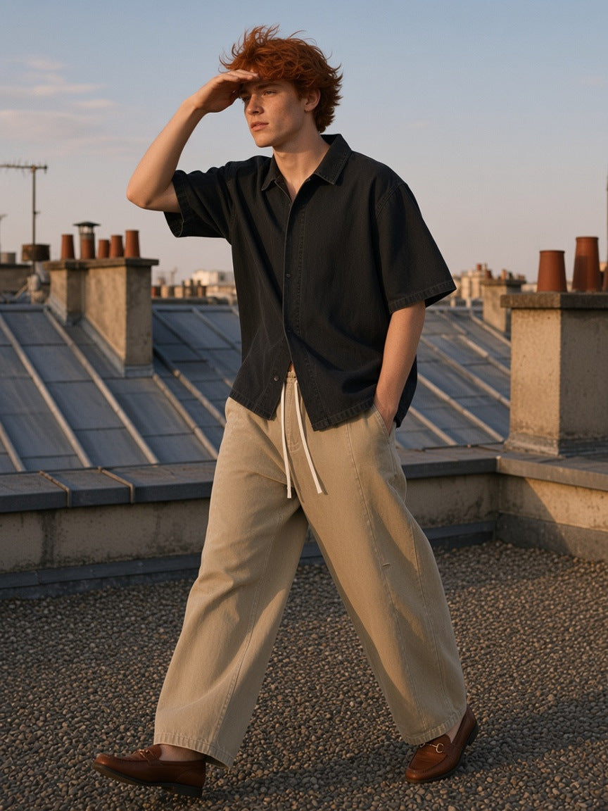 Part of the look Slow Burn: man in a black vintage-wash lyocell shirt and khaki mineral-wash barrel pants
