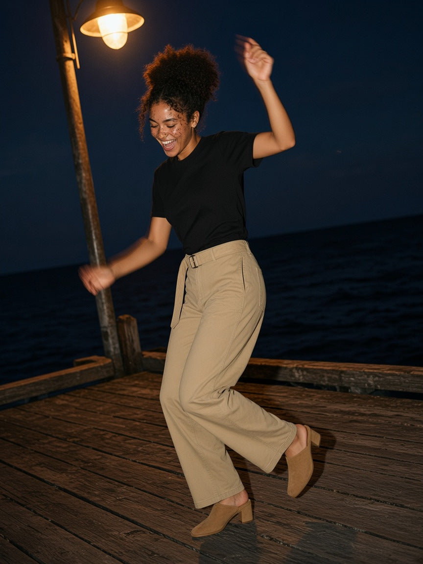 Part of the look Tonic: woman in a black crewneck knit tee and khaki belted barrel-leg chinos