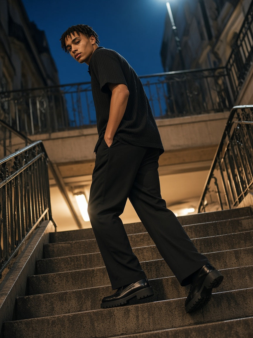 Part of the look Velvet Hour: man in a black jacquard shirt and black adjustable-waist straight-leg pants