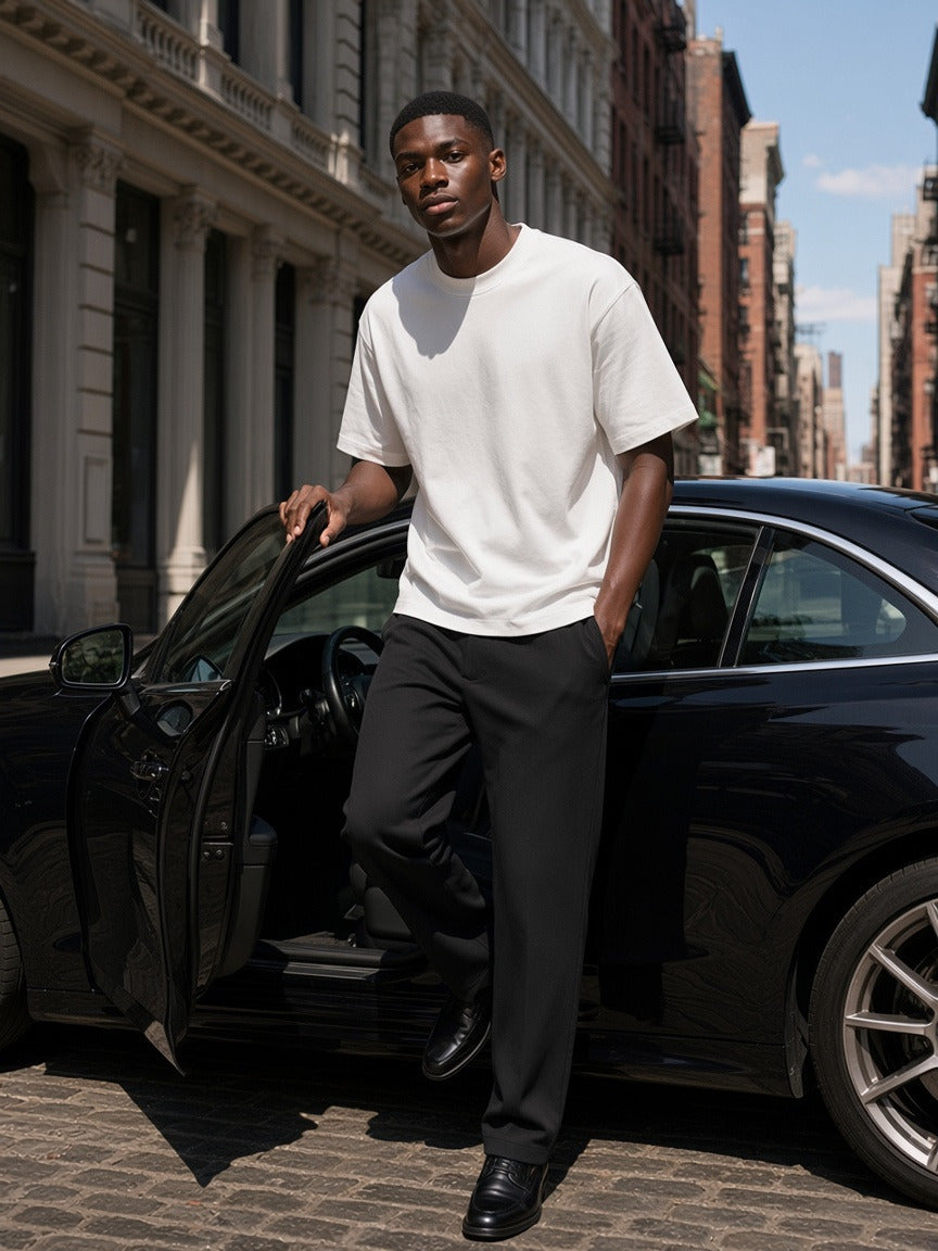 Man wearing the Men's Boxy Oversized T-Shirt in White, full-length model photo