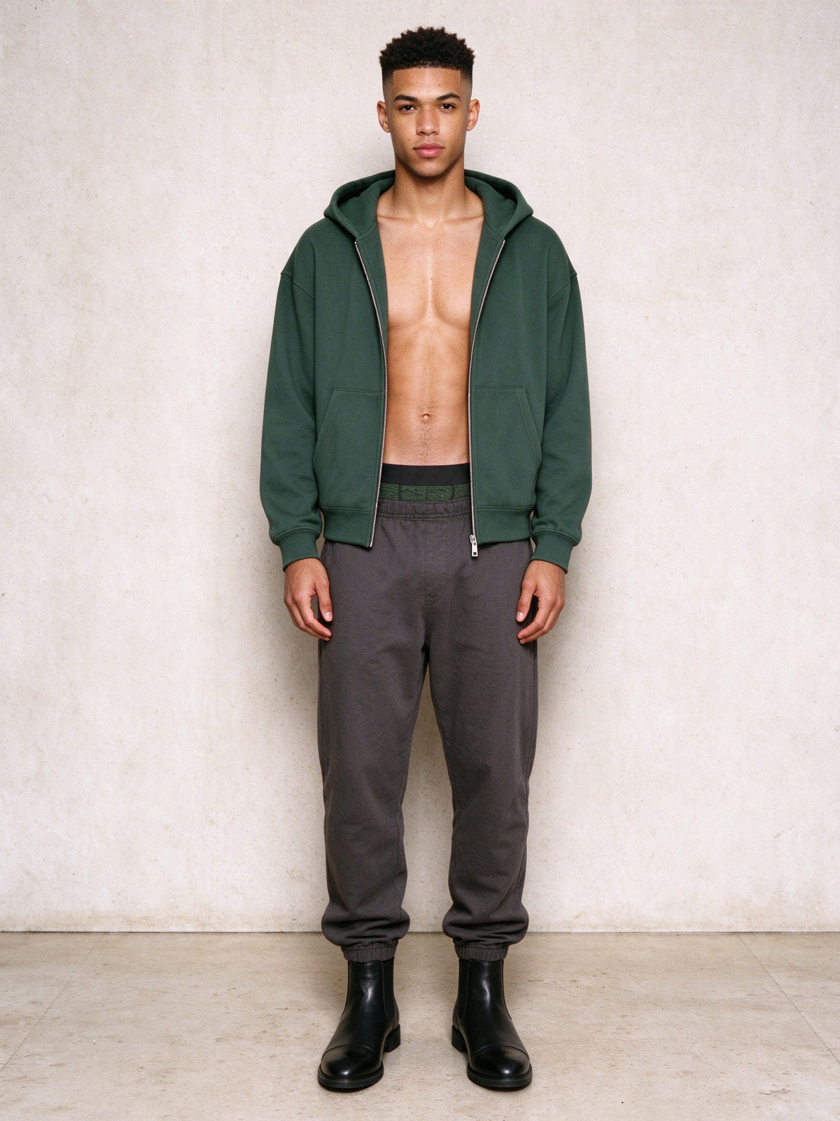 Man in the Men's Heavyweight Full Zip Hoodie in Blackish Green