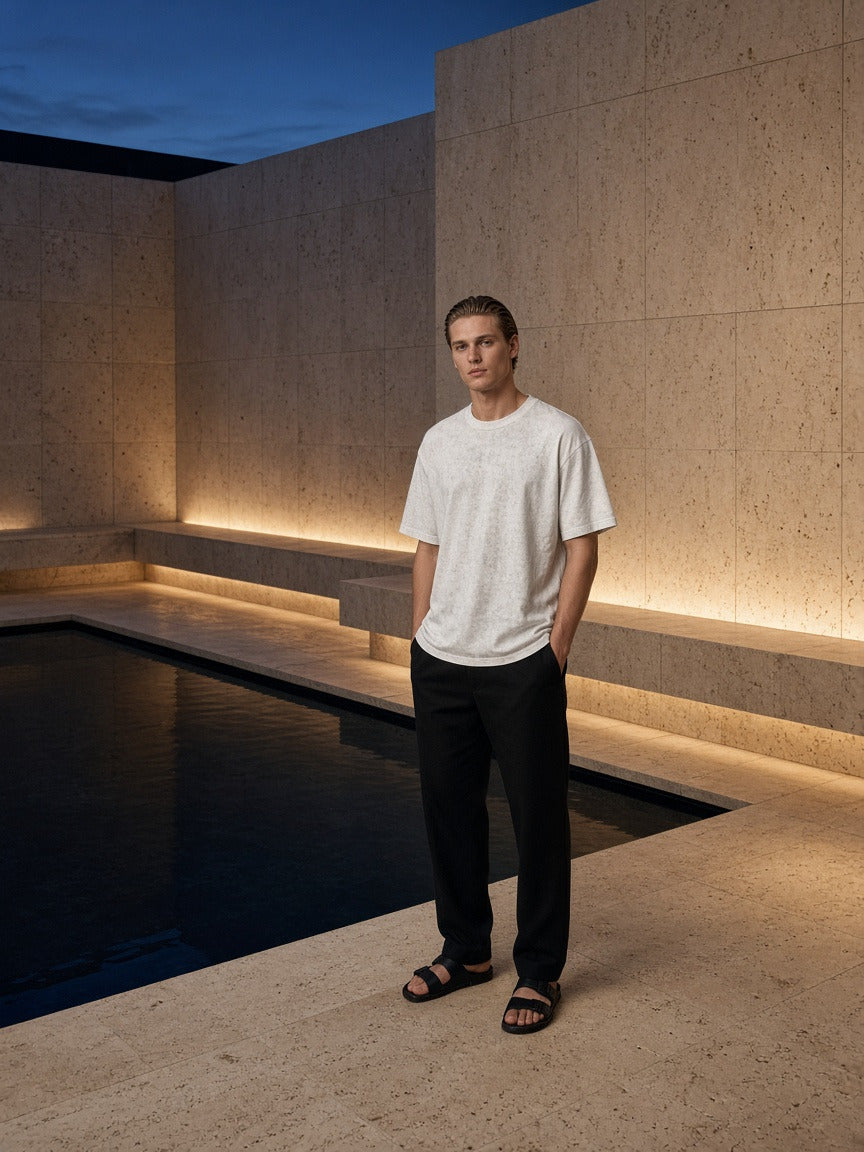 Man wearing the Men's Heavyweight Mineral Wash Boxy T-Shirt in White, full-length model photo
