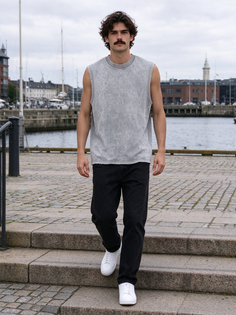 Man wearing the Men's Snow Washed Frayed Hem Tank Top in Light Gray, full-length model photo