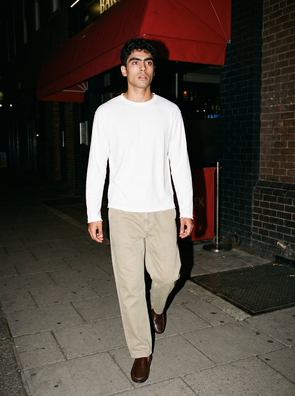 Friends together, one wearing the Marcel Afters Mineral Wash Barrel Leg Pants, Light Tones in Khaki