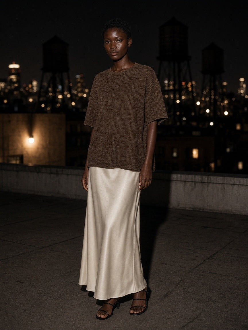 Woman in the Mineral Wash Boxy Waffle T-Shirt in Coffee on a Tribeca rooftop in New York at night