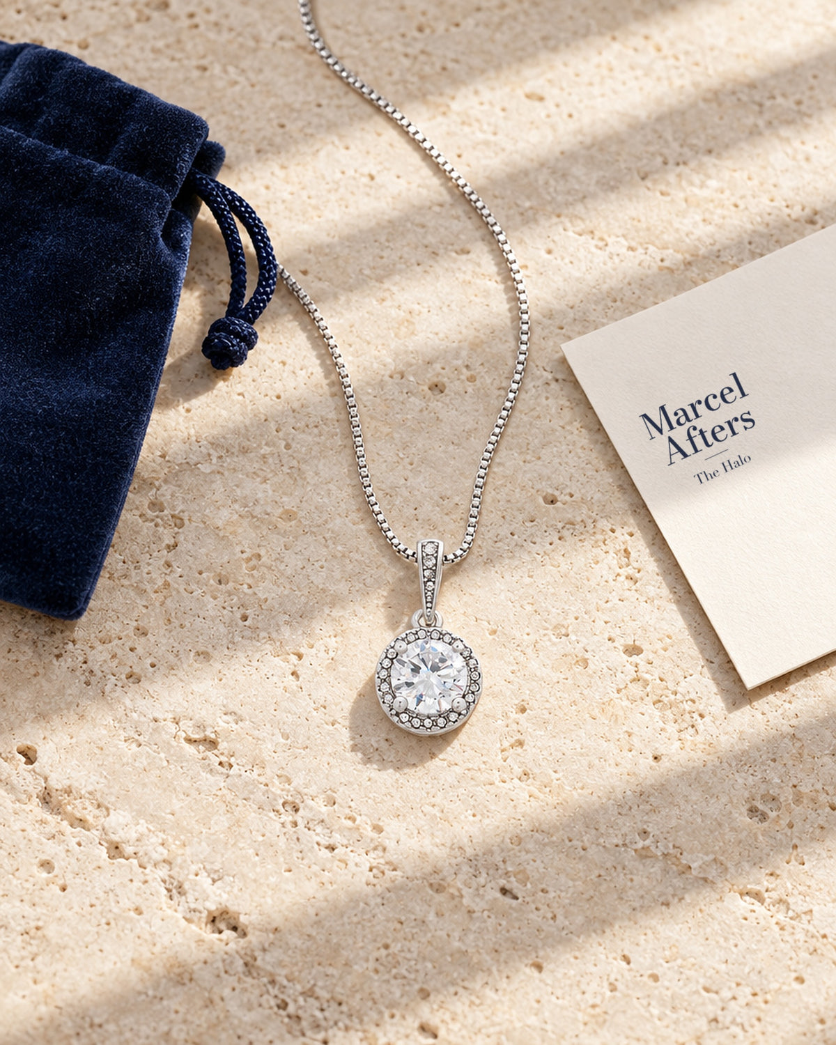 Round Crystal Halo Pendant Necklace — flat lay with Marcel Afters gift card and pouch