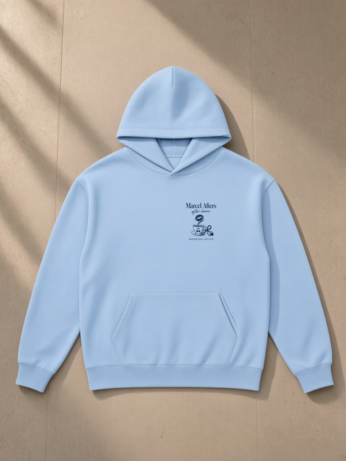 Morning After heavyweight pullover hoodie in Sky Blue, laid flat on pale limestone