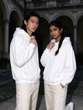 Two people wearing the Oversize Heavyweight Fleece Hoodie in Lucent White, full-length model photo