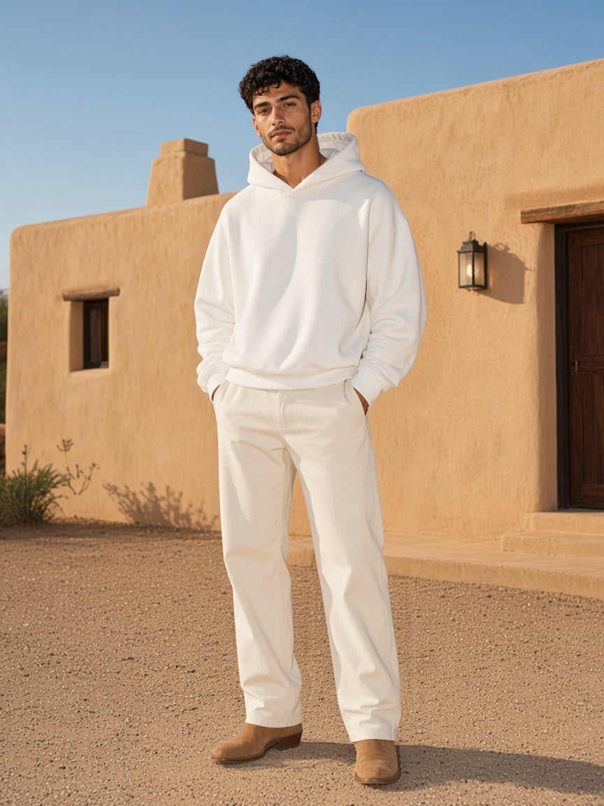 Marcel Afters Oversized Drop Shoulder Hoodie in White, worn by a woman, against a plain white background