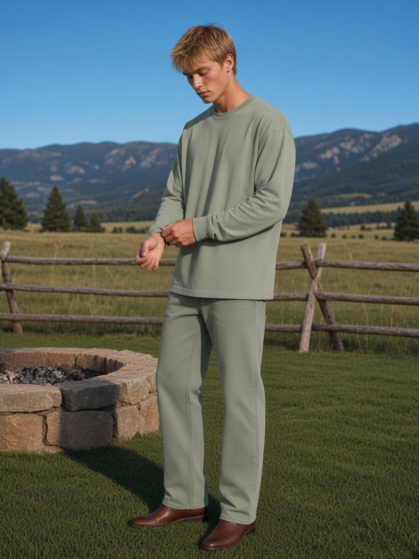 Marcel Afters Oversized Long Sleeve T-Shirt in Gray Green, worn by a man, field