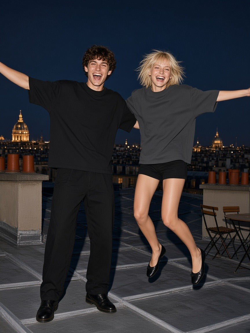 Two people wearing the Oversized One-Piece Boxy T-Shirt in Black and Dark Gray, full-length model photo