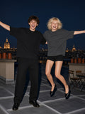 Two people wearing the Oversized One-Piece Boxy T-Shirt in Black and Dark Gray, full-length model photo