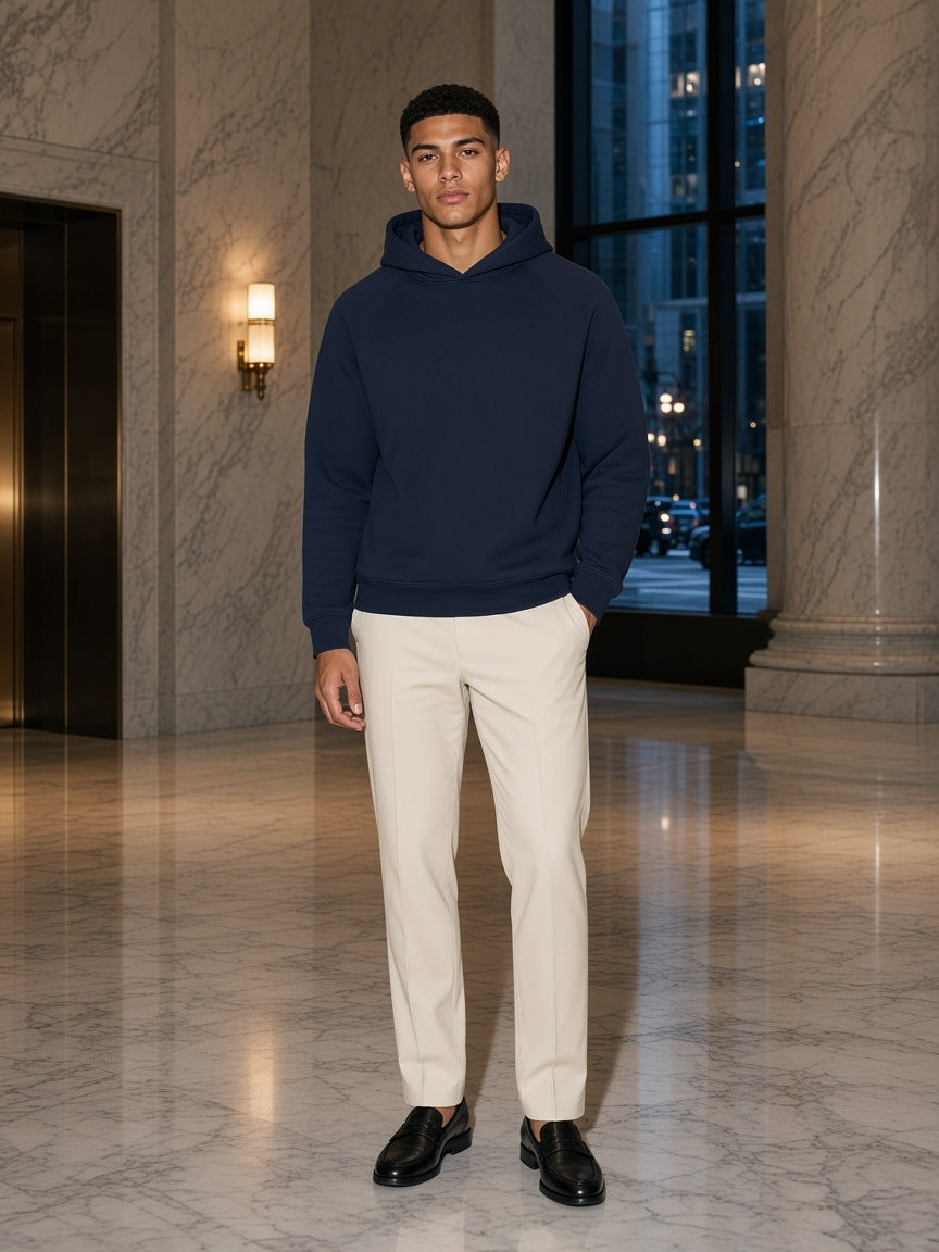 Marcel Afters Oversized Raglan Pullover Hoodie in Navy Blue, worn by a man, elevator