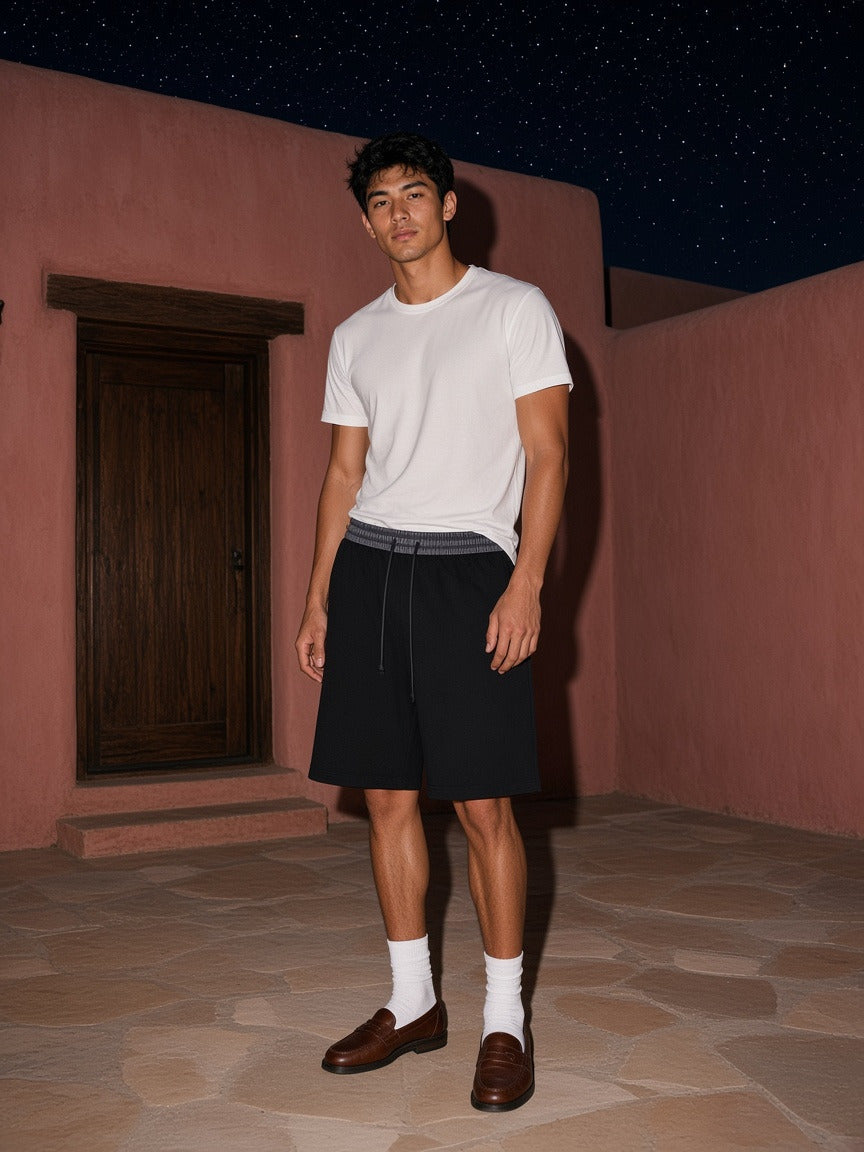 Model wearing the Plaid Waistband Shorts in Black, full-length model photo
