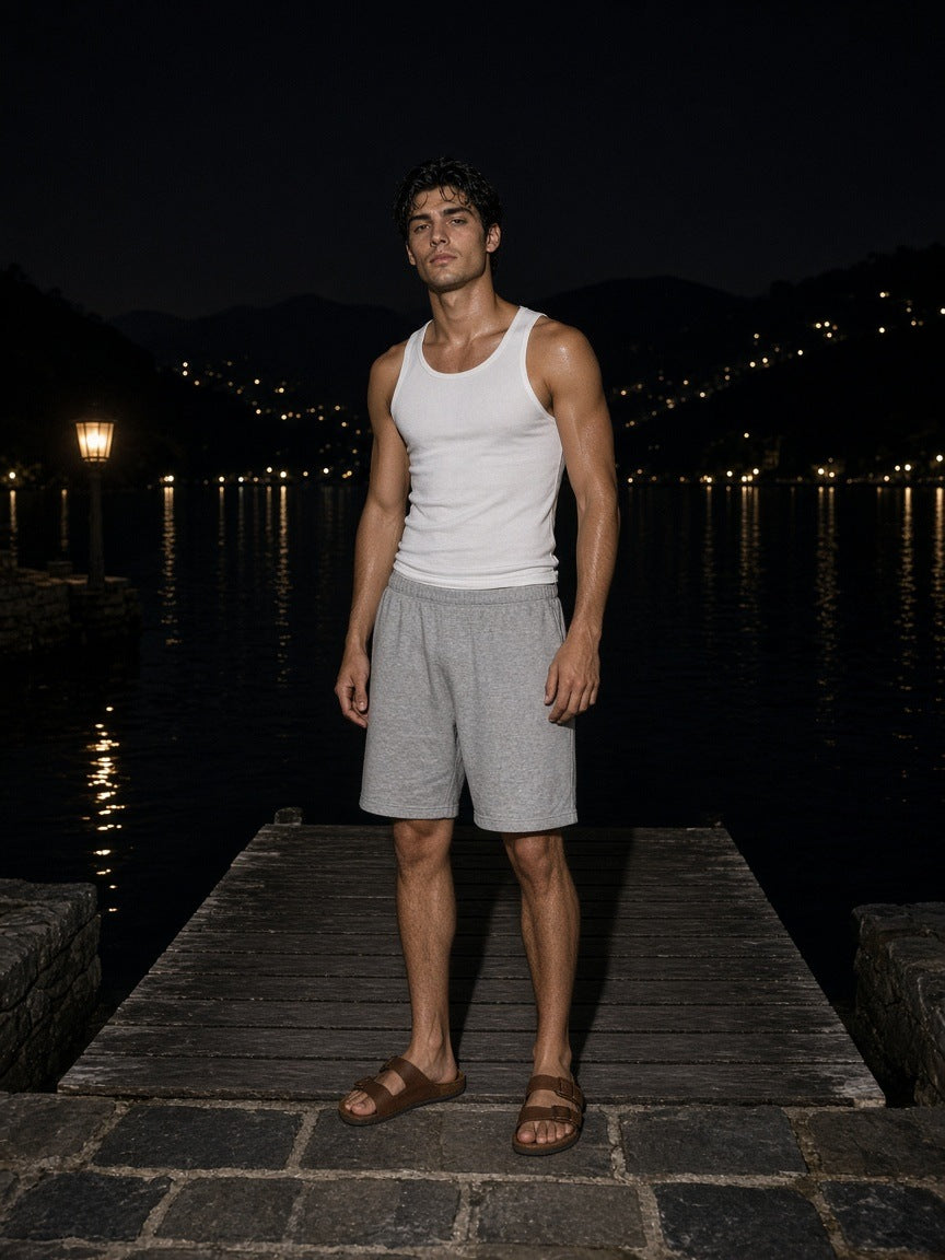 Marcel Afters Regular Fit Shorts in Gray, worn by a man, on a dock at night