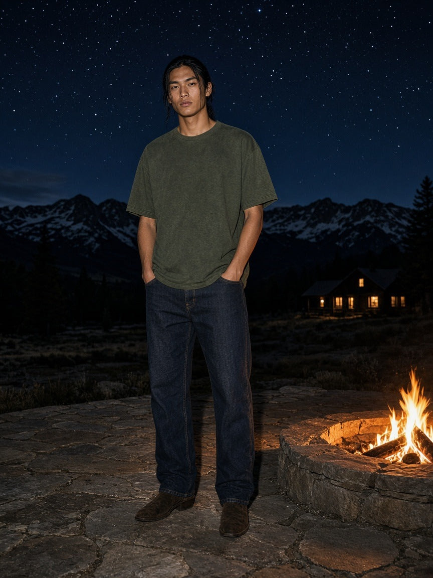 Marcel Afters Reverse Dyed Loose Cotton T-Shirt in Green, worn by a man, night