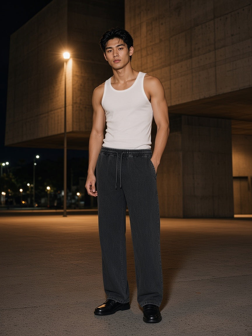 Marcel Afters Snow Wash Heavyweight Sweatpants in Black, worn by a man, outdoor