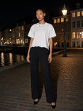 Model wearing the Snow Wash Raw-Hem Boxy T-shirt in Washed White, full-length model photo