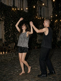 Two people in the Snow Washed Frayed Hem Tank Top in Dark Gray and Black dancing in a Paris courtyard after hours