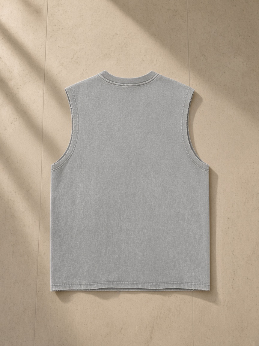 Snow Washed Frayed Hem Tank Top in Light Gray, laid flat on pale limestone, back.