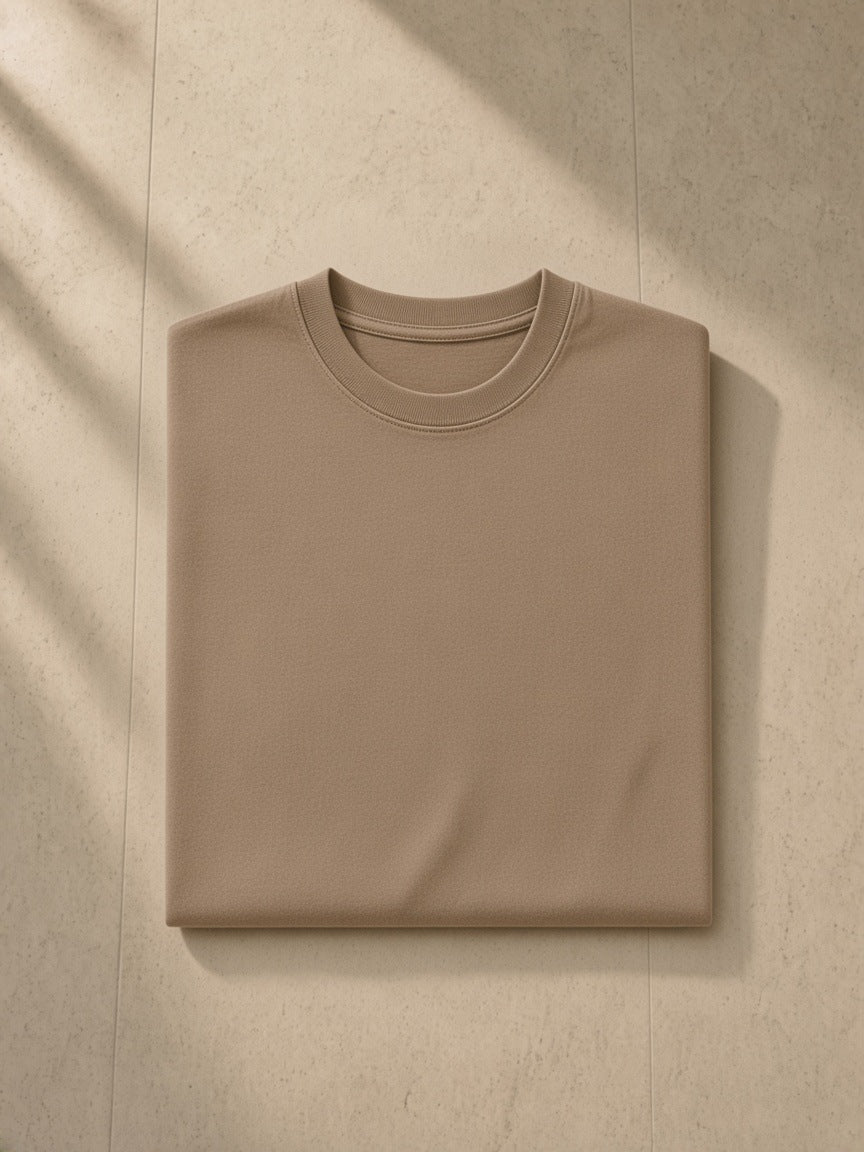 Marcel Afters Snow Washed Heavyweight Oversize T-Shirt in Coffee, laid flat, wooden floor