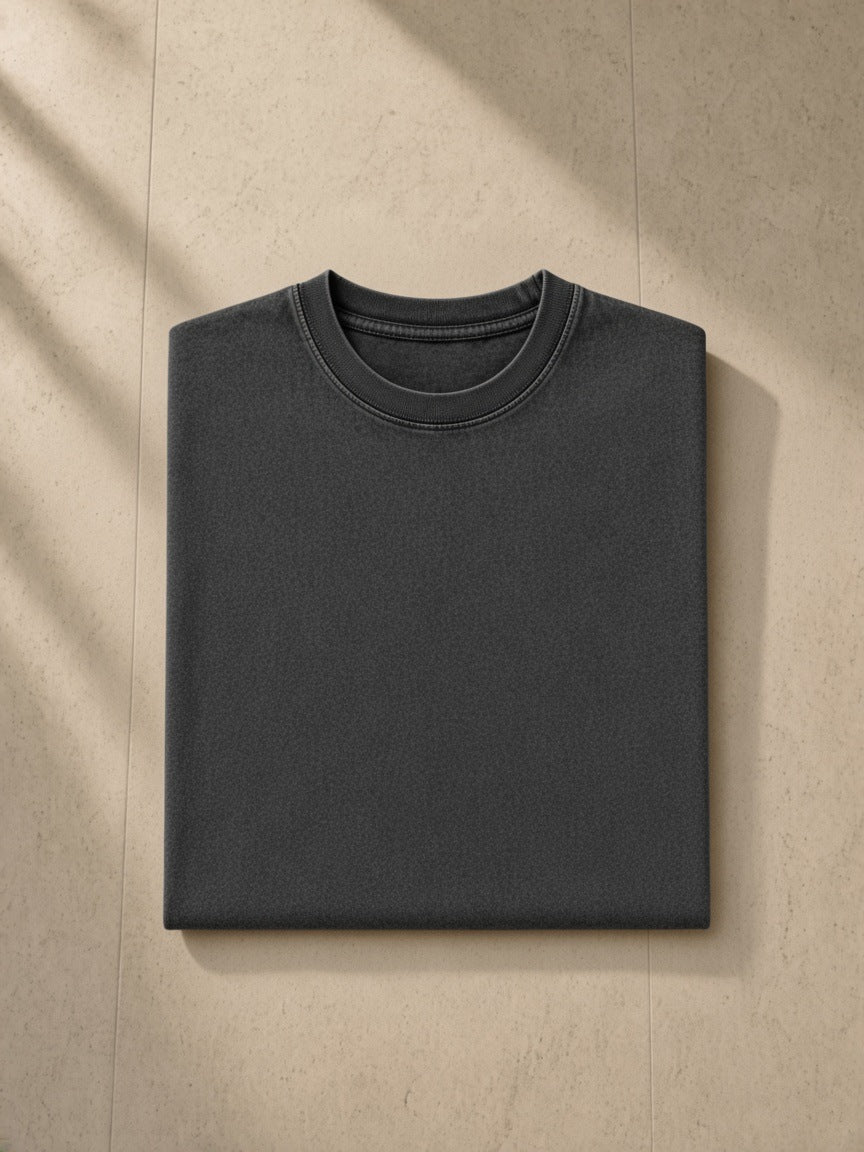 Marcel Afters Snow Washed Heavyweight Oversize T-Shirt in Black, worn by a woman, against a plain white background