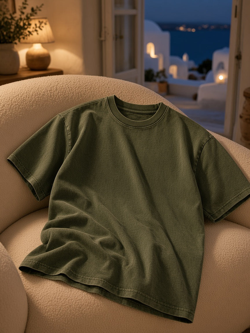 Marcel Afters Snow Washed Heavyweight Oversize T-Shirt in Green, laid flat, living room
