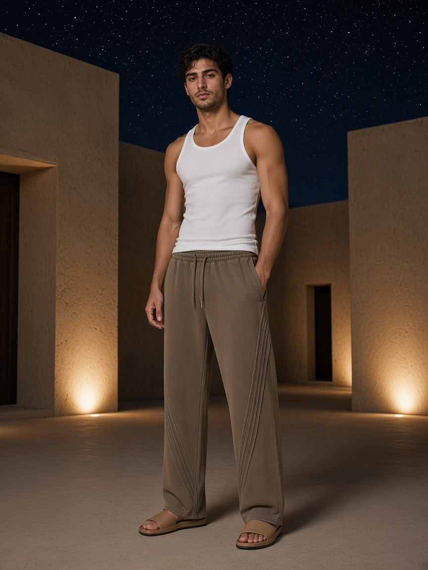 Model wearing the Snow Washed Tape Raw Edge Sweatpants in Khaki, full-length model photo