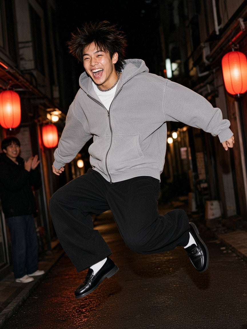 Marcel Afters Snow Washed Tape Raw Edge Zip Hoodie in Light Gray, worn by a man, alley