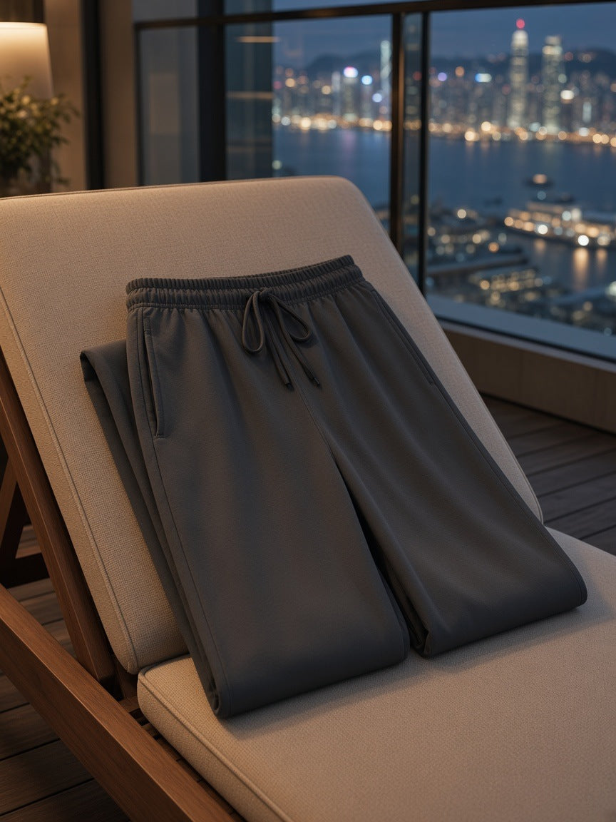 Marcel Afters Solid Color Straight-Leg Sweatpants in Dark Gray, laid flat, city rooftop at dusk