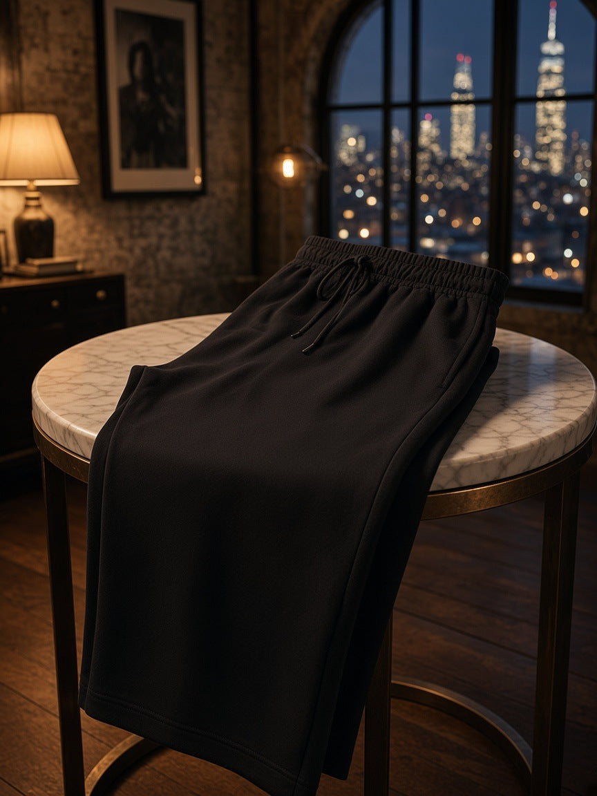 Marcel Afters Solid Color Straight-Leg Sweatpants in Black, laid flat, dark room