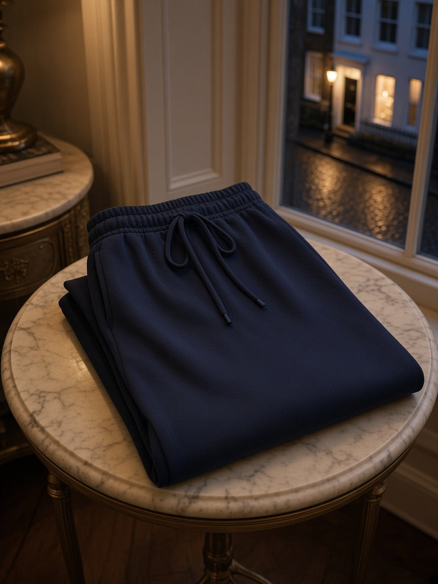 Marcel Afters Solid Color Straight-Leg Sweatpants in Navy Blue, laid flat, room