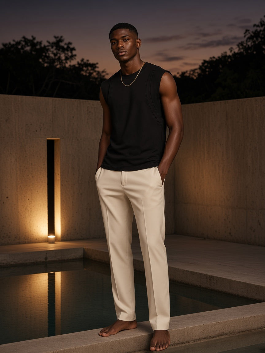 Marcel Afters Spliced Panel Sleeveless Muscle T-Shirt in Black, worn by a man, outdoor