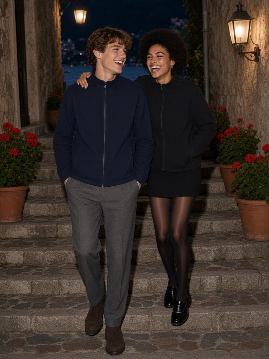 Marcel Afters Stand Collar Jacket in Navy Blue, worn by a man and a woman, walking arm in arm down garden steps at night