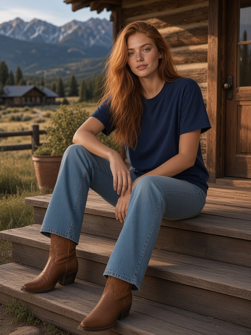 Marcel Afters Sun Fade Raw Edge T-Shirt in Navy Blue, worn by a woman, cabin