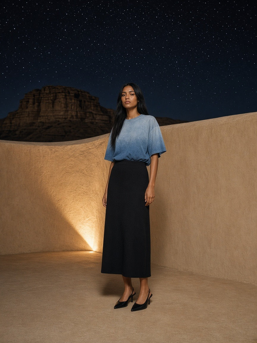 Marcel Afters Sunfade T-Shirt in Blue, worn by a woman, desert