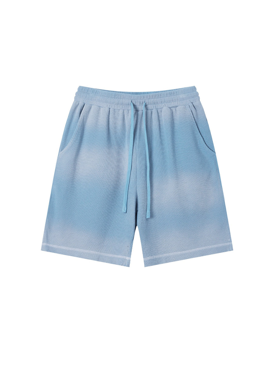 Marcel Afters Sunfade Waffle Raw Hem Shorts in Sky Blue, worn by a woman, plain white background