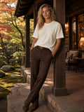 Marcel Afters Textured Waffle Washed Boxy T-Shirt in White, worn by a woman, porch