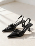 The After Six Slingback in Black, pair on pale limestone