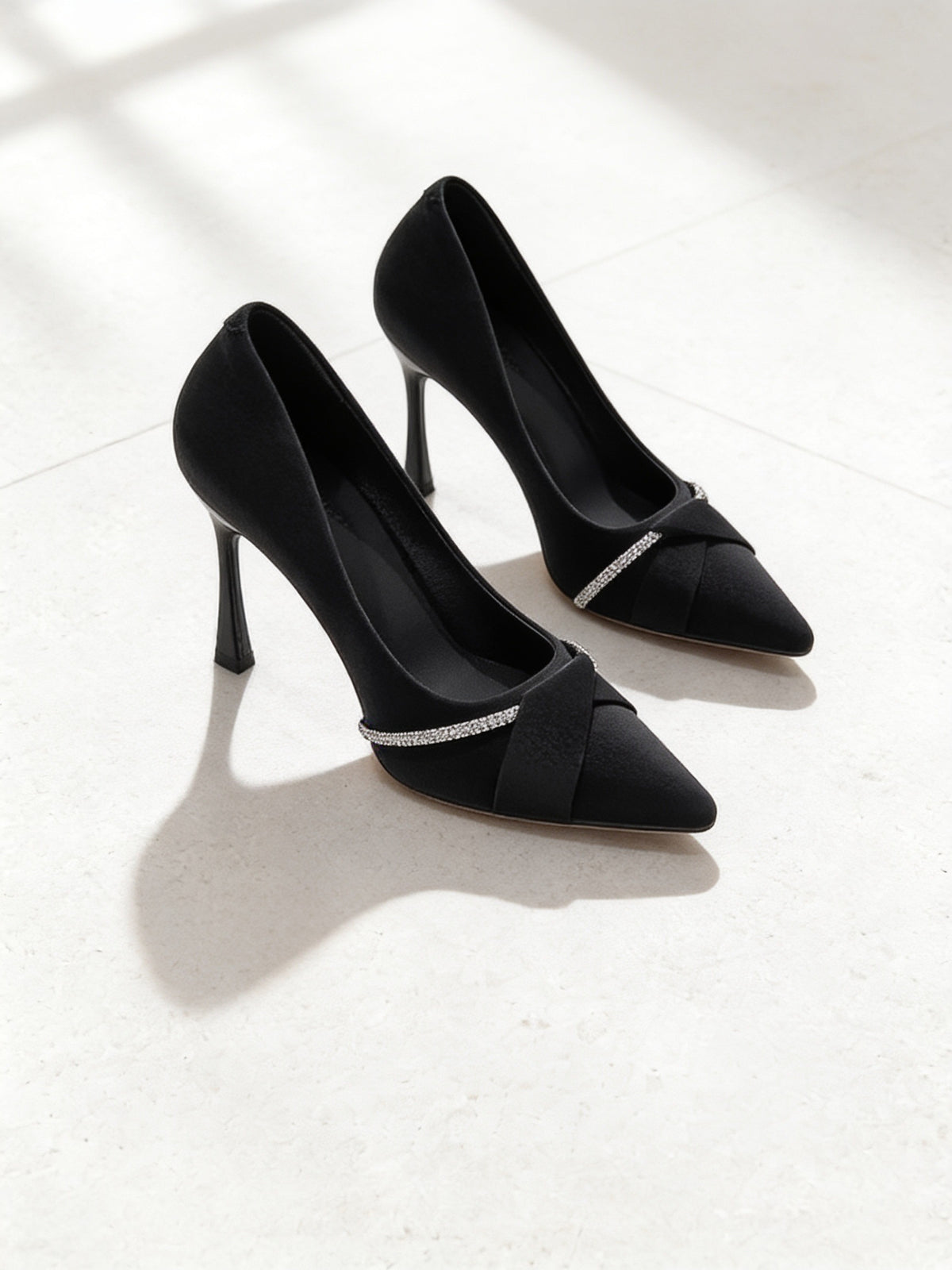 The Cocktail Hour Pump in Black, pair on pale limestone