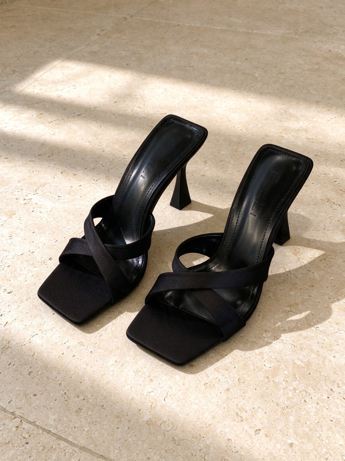 The Crossroads Mule in black, second studio angle on limestone