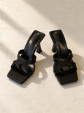 The Crossroads Mule in Black, pair on pale limestone