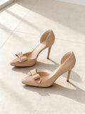 The Curtsy Pump in Nude, pair on pale limestone