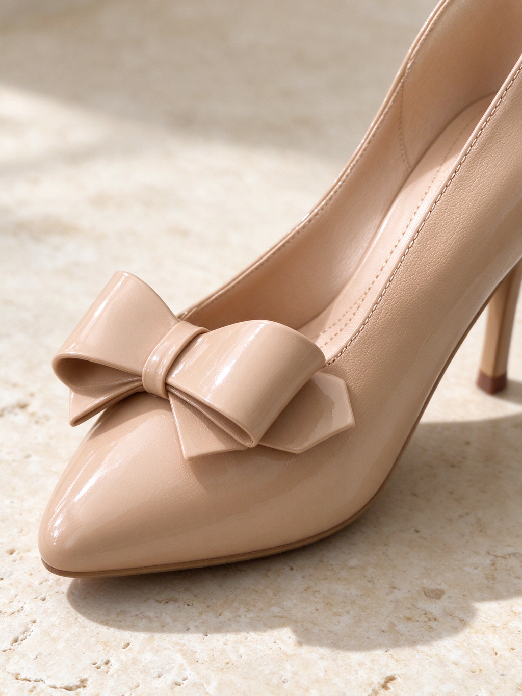 The Curtsy Pump in nude, detail shot: leather, stitching, sole or hardware