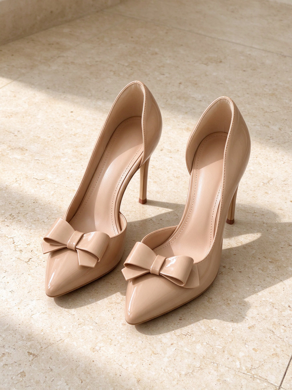 The Curtsy Pump in nude, second studio angle on limestone
