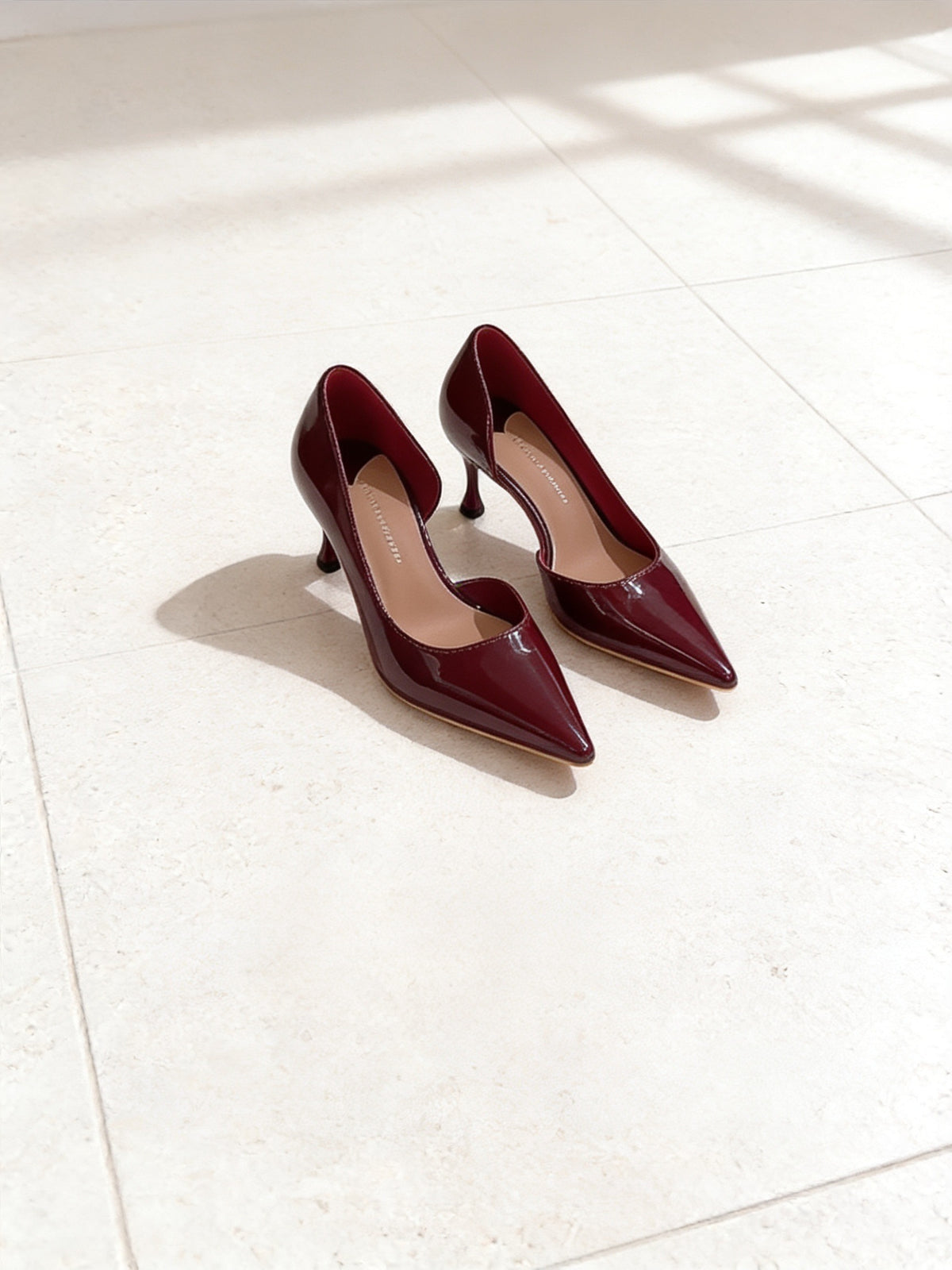 The Last Word Pump in Burgundy, pair on pale limestone